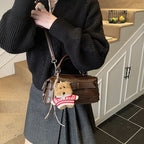 Women's mini handbag with charming animal pendant