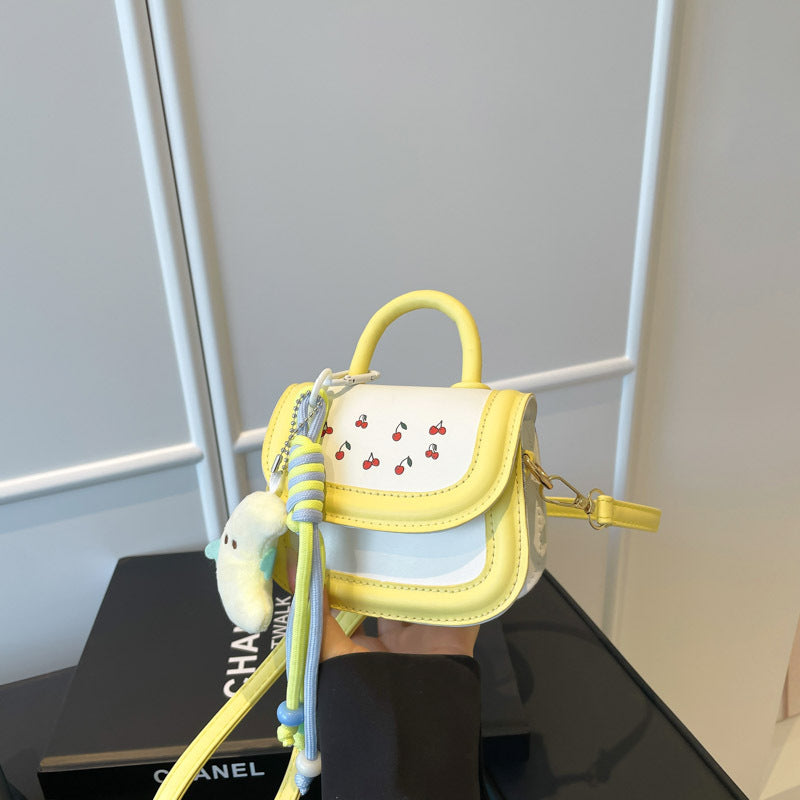 Women's mini handbag with cheerful cherry design and charming pendants
