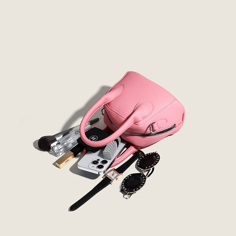Women's mini handbag with structured exterior and detachable shoulder strap