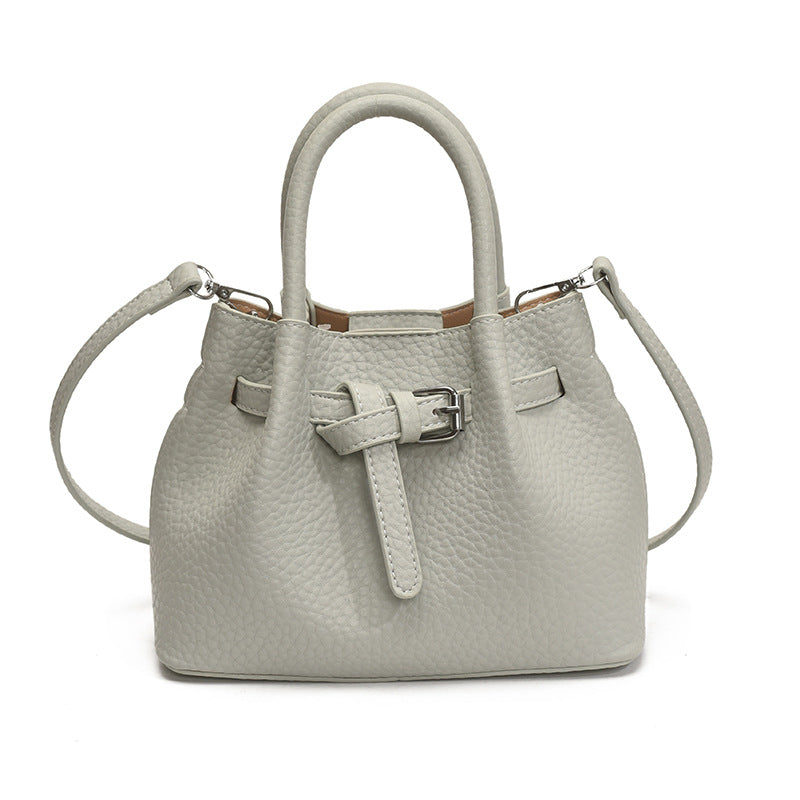 Women's mini handbag with stylish button closure