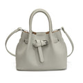 Women's mini handbag with stylish button closure