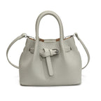 Women's mini handbag with stylish button closure