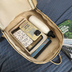 City backpack with versatile compartments and breathable carrying system