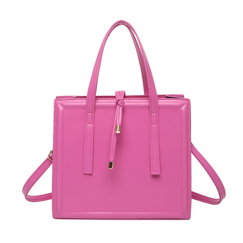 Women's elegant handbag in minimalist design with detachable shoulder strap