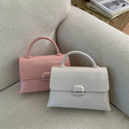 Women's handbag with textured design and elegant closure