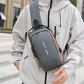 Shoulder bag with ergonomic design and multiple compartments
