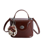 Ladies elegant mini handbag with stylish charm