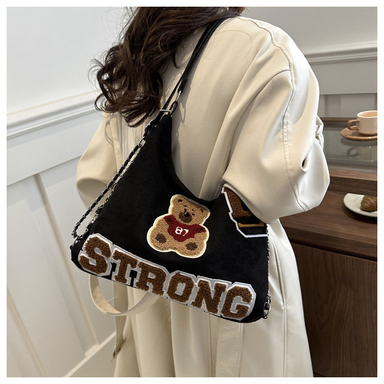 Shoulder bag in playful bear pattern