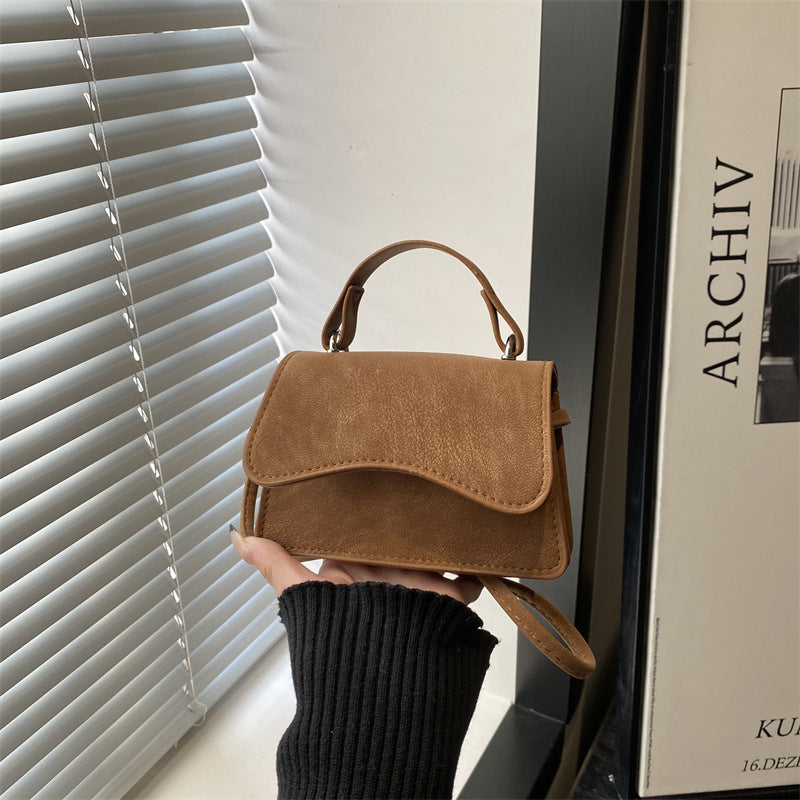 Women's mini handbag with removable carry handle