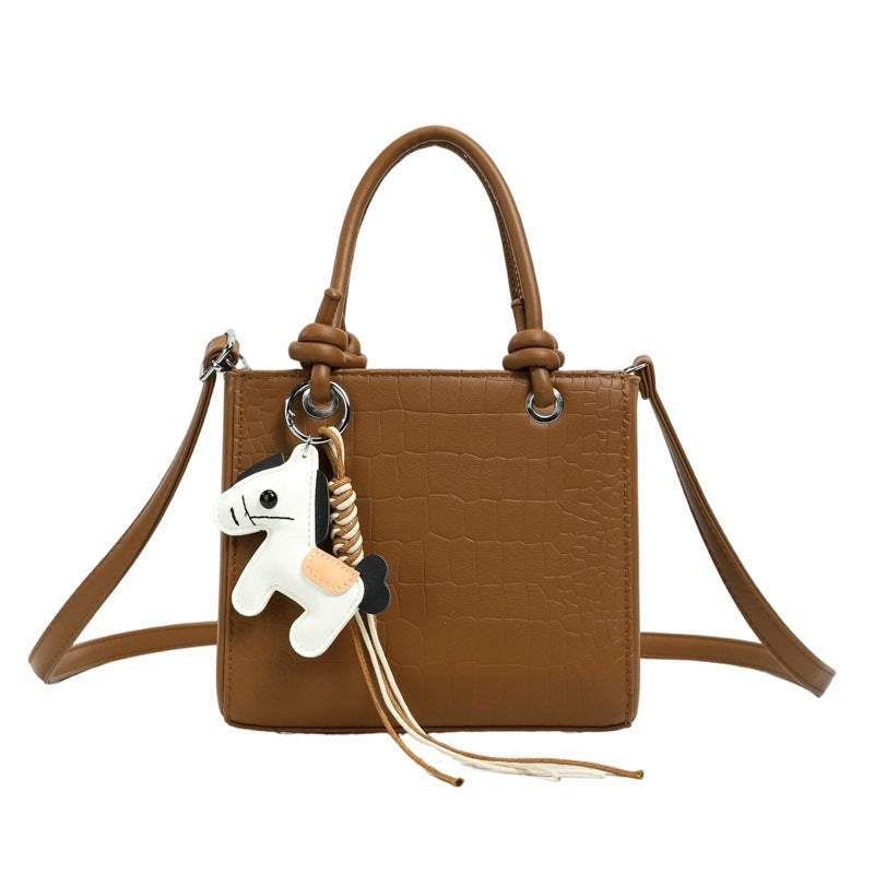 Women's mini bag with animal charm and modern crocodile look