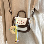 Women's mini handbag with cheerful cherry design and charming pendants