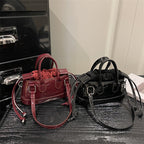 Women's mini bag with playful drawstring and shiny finish