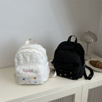 Plush backpack with playful design
