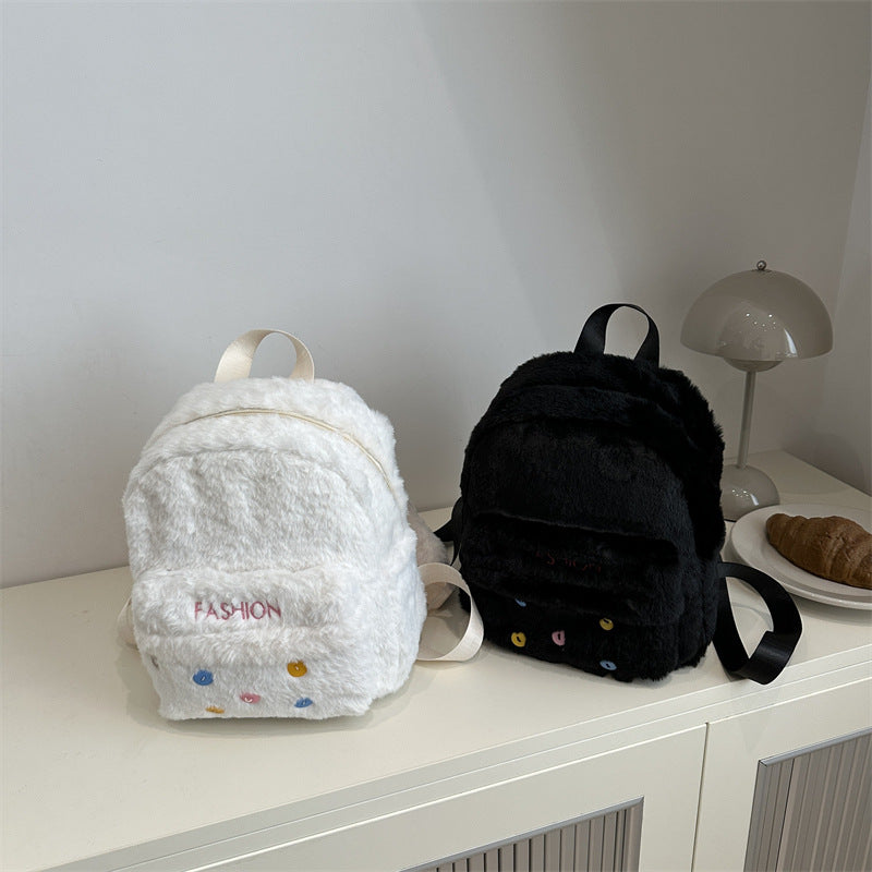 Plush backpack with playful design