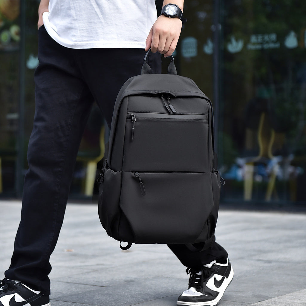 Practical city backpack with multiple compartments and waterproof material