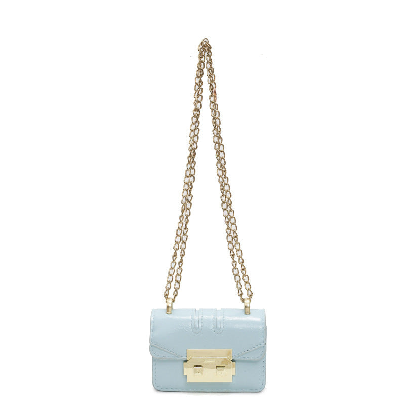 Women's elegant mini handbag with gold fastening mechanism