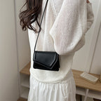 Women's mini handbag with elegant clasp closure technique