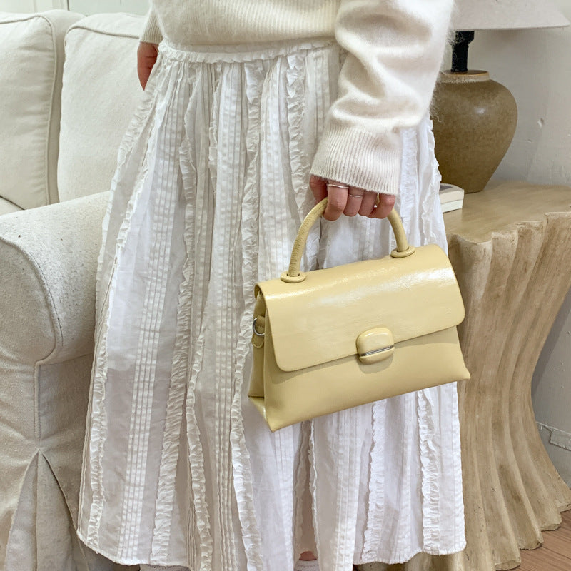Women's handbag with textured design and elegant closure