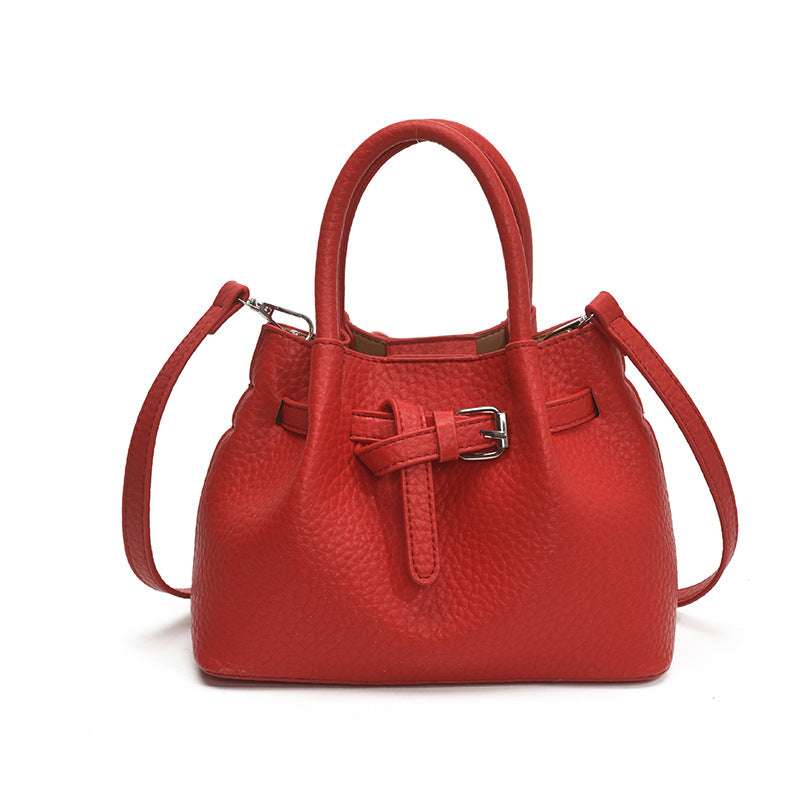 Women's mini handbag with stylish button closure