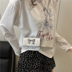 Women's clutch with playful bow design