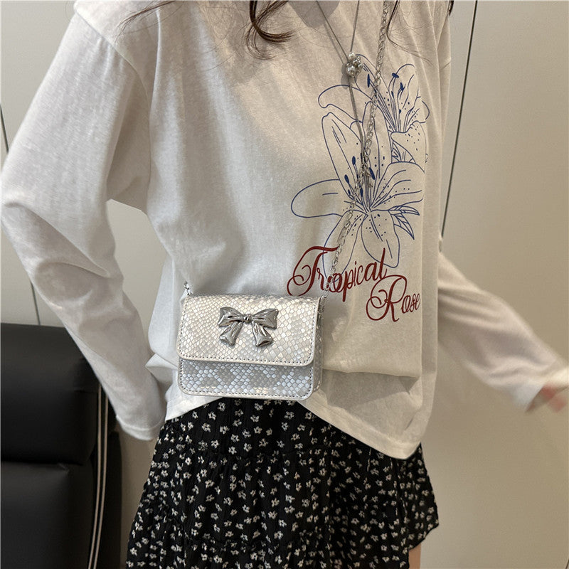 Women's clutch with playful bow design