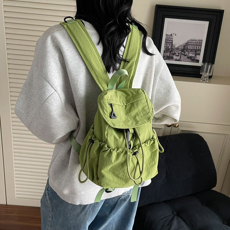 Leisure backpack with elastic drawstring and practical side pockets