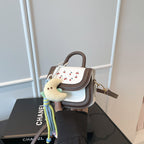 Women's mini handbag with cheerful cherry design and charming pendants