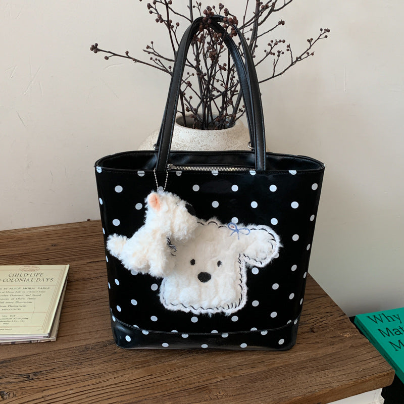 Plush shoulder bag with playful dog motif