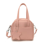 Ladies mini bag with decorative pendant