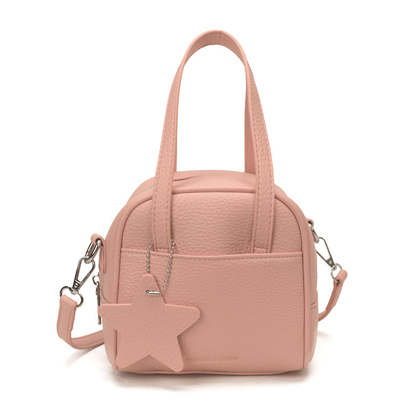 Ladies mini bag with decorative pendant