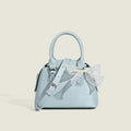 Women’s mini handbag with playful bow accent