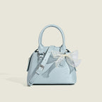 Women’s mini handbag with playful bow accent