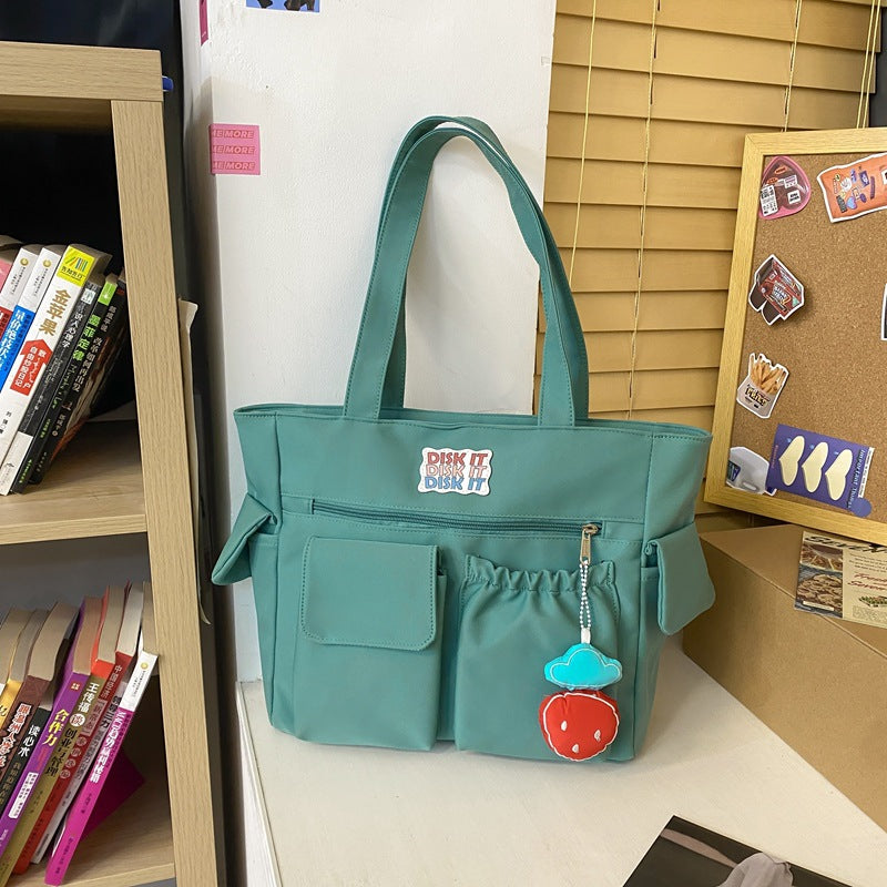 Tote bag with versatile compartments and ergonomic design