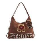 Shoulder bag in playful bear pattern