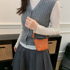 Women's mini handbag with shiny chain and textured upper material