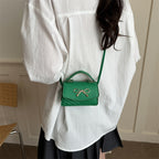 Women’s mini handbag with elegant bow decoration