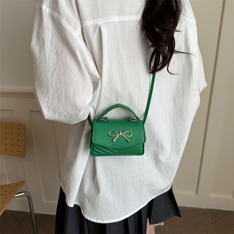 Women’s mini handbag with elegant bow decoration