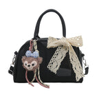 Ladies Mini Handbag with playful animal motif and charming charm