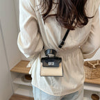 Ladies mini handbag with luxurious leather look and practical carrying handles
