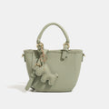 Women's mini handbag with playful animal charm
