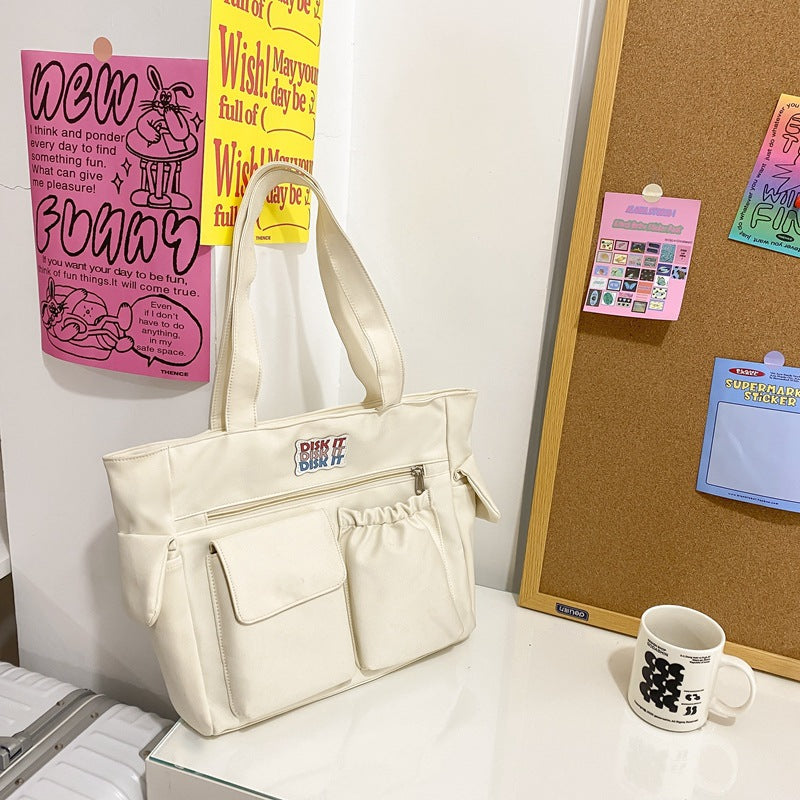 Tote bag with versatile compartments and ergonomic design