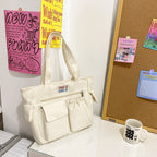 Tote bag with versatile compartments and ergonomic design