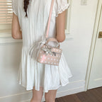 Women's mini handbag with playful design and elegant accents