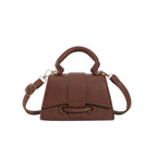 Women's mini handbag with textured leather and stylish closure