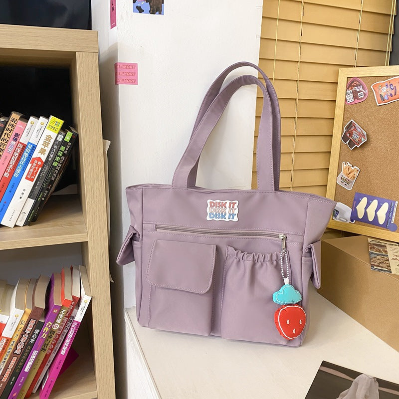 Tote bag with versatile compartments and ergonomic design