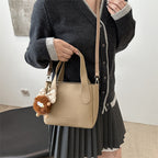 Women’s mini bag with playful animal pendant
