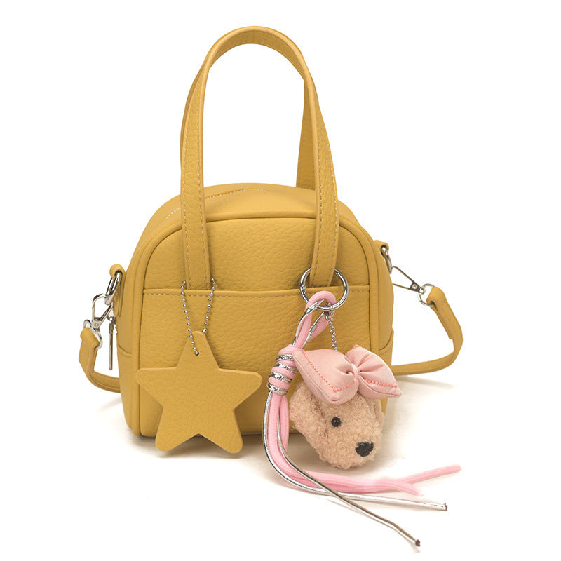 Ladies mini bag with decorative pendant