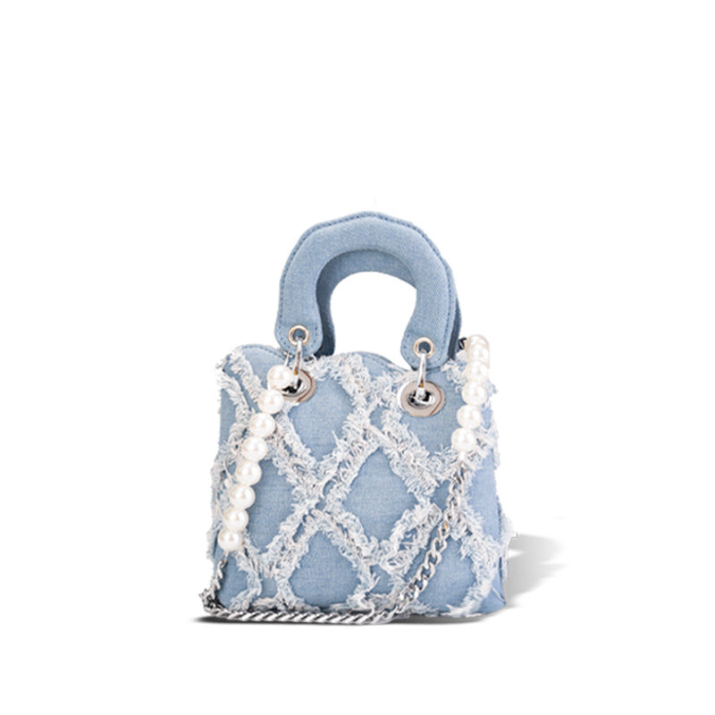 Women’s mini handbag with striking cinched design and pearl accents