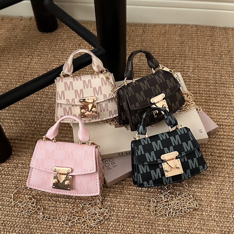 Women's mini handbag with decorative chain strap