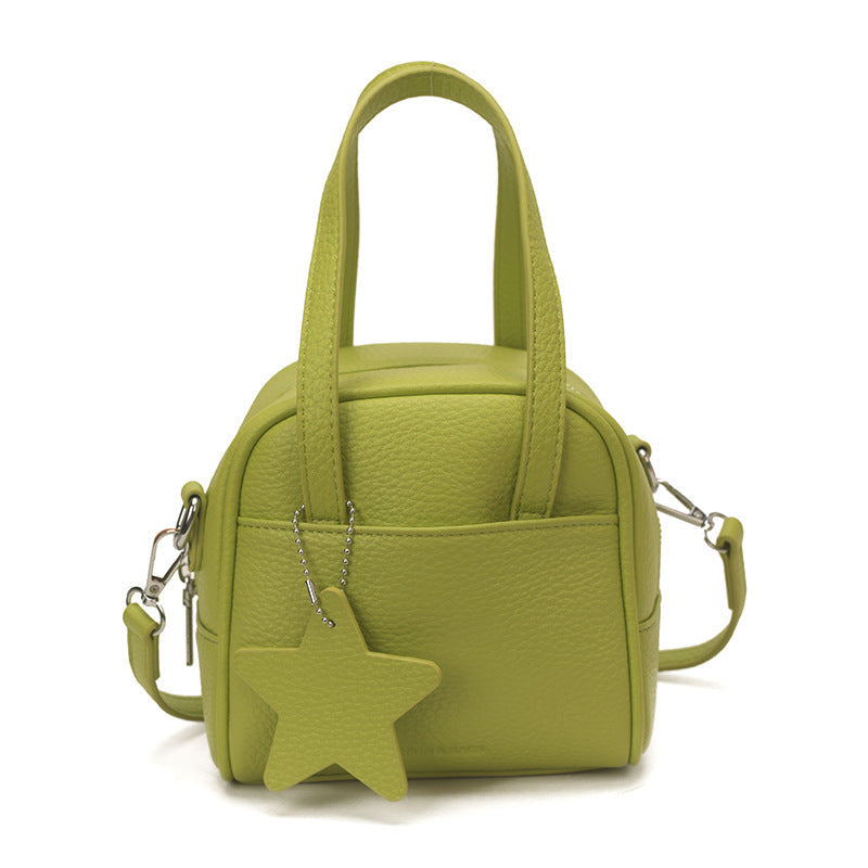 Ladies mini bag with decorative pendant